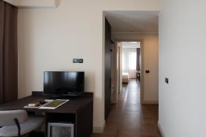 TV o dispositivi per l'intrattenimento presso Hotel Carlton