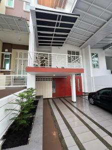 a house with a car parked in front of it at Summer Villa Batu Ferringhi in Tanjung Bungah