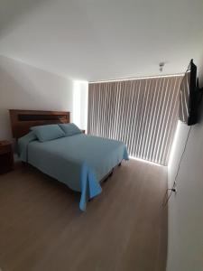 Ένα ή περισσότερα κρεβάτια σε δωμάτιο στο Departamento en Coquimbo