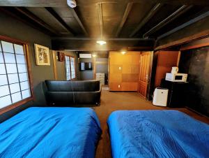 Letto o letti in una camera di 四季の宿 徹星