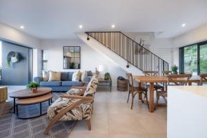 a living room with a couch and a table at Moyana 14 in Ballito +29 photos