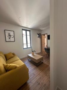 a living room with a couch and a table at T2 Ed Warner in Narbonne