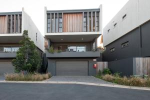 a building with a garage in front of it at Moyana 14 in Ballito