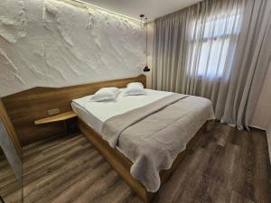 Voodi või voodid majutusasutuse Cross Resort Hotel toas