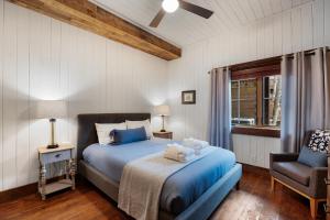 a bedroom with a bed with a teddy bear on it at Around the Bend in Blue Ridge