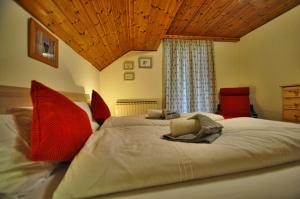 Postel nebo postele na pokoji v ubytování Gasthaus Chalet Mur