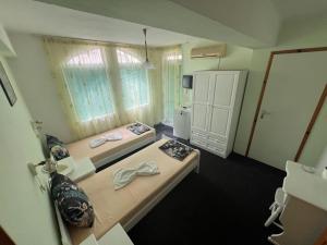Postel nebo postele na pokoji v ubytování Guesthouse Flora