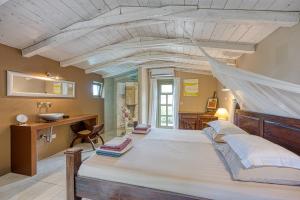 a bedroom with a large bed with a mosquito net at Villa Menta 2 2445 in Malinska +36 photos