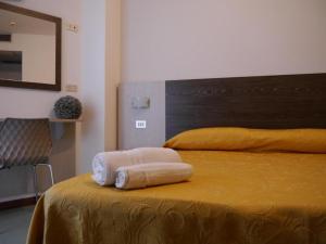 Postel nebo postele na pokoji v ubytování Hotel Monaco - parcheggio incluso e piscina - min 2 gg
