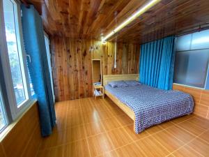 Postel nebo postele na pokoji v ubytování Vườn của mẹ