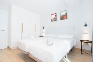 Postel nebo postele na pokoji v ubytování Sholeo Lodges La Cícer Flats