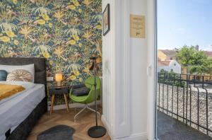 Postel nebo postele na pokoji v ubytování V62 studio apartments- Downtown Sopron