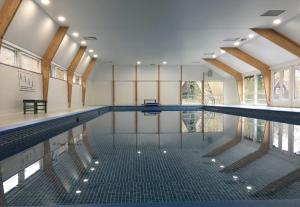 an indoor swimming pool with at Chalet 139 Hakuna Matata in Durbuy