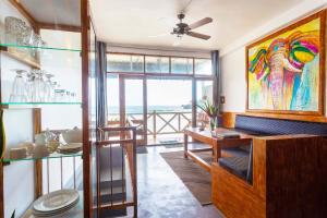a dining room with a view of the ocean at Villa Surf Beach in Galle