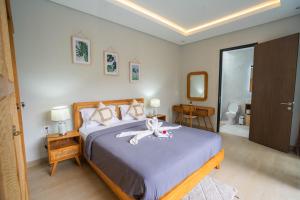 Ένα ή περισσότερα κρεβάτια σε δωμάτιο στο Casa Palm Pecatu +46 φωτογραφίες