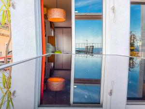 a view of a balcony from a house with glass doors at Attic by Unik Vacation in Tarragona
