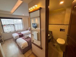 Rúm í herbergi á ViaVia Boutique Hotel - Kathmandu