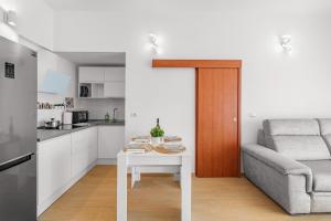 a small living room with a table and a couch at Aurelia Sunset home in Rome