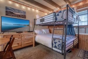 a bedroom with a bunk bed and a desk at Mother Nature's Inn in Tahoe City +76 photos