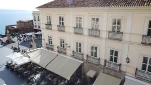 an overhead view of a building with a white awning at Hotel della Piazza in Pizzo