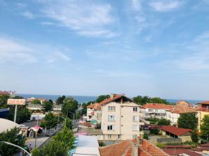 a view of a city with buildings and a blue sky at Colors Boutique in Obzor