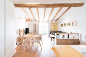 a bedroom with a bed and a table and chairs at Cos del Bou - Unik Vacation in Tarragona