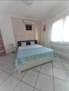 Postel nebo postele na pokoji v ubytování B&B Casa Vacanze La Mimosa Alghero