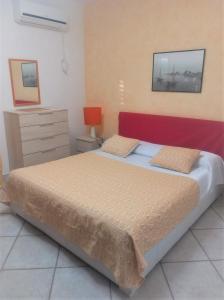 Postel nebo postele na pokoji v ubytování B&B Casa Vacanze La Mimosa Alghero