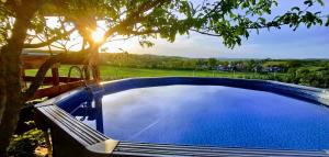 The swimming pool at or close to Kukucs Etyek Dézsafürdő Vendégház