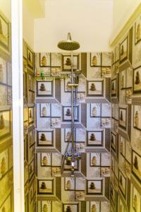 a room with a wall of pictures on the wall at Villa Surf Beach in Galle