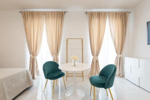 A bed or beds in a room at Quattro Perle