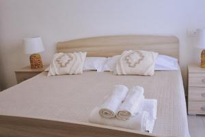Postel nebo postele na pokoji v ubytování B&B Santa Filomena