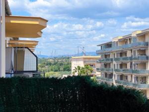 a view of some buildings in a city at Palm Beach by Unik Vacation in La Pineda +39 photos