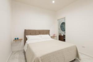 A bed or beds in a room at Quattro Perle