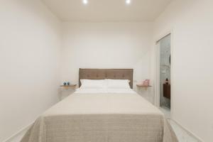 A bed or beds in a room at Quattro Perle