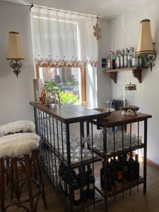 a room with a table with bottles of wine at Albergo Aprica Garni in Aprica