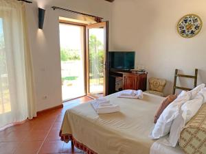Postel nebo postele na pokoji v ubytování Resort Fonte Vulci