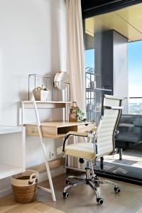 an office with a desk and a chair at Luxurious City Retreat Balcony & Pool Access in Luxembourg +27 photos