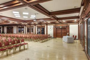 a conference room with a table and chairs at Verdi Budapest Aquincum in Budapest