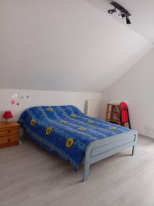 Ένα ή περισσότερα κρεβάτια σε δωμάτιο στο Location chez l habitant