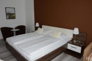 Postel nebo postele na pokoji v ubytování Apartmány - Frymburk My Family
