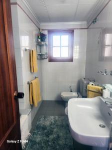 a bathroom with a sink and a toilet at AGAMARI La Mata Torrevieja sun apartment in Torrevieja