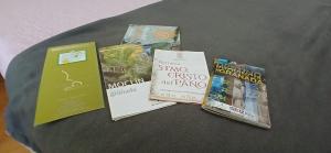 a group of books sitting on top of a table at Casa María in Moclín
