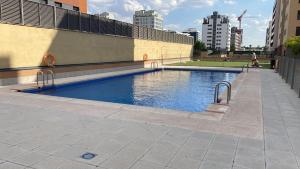 a swimming pool in the middle of a city at APARTAMENTO LUXURY in Madrid