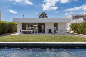 a house with a pool in front of it at Precious House in Comporta in Carvalhal
