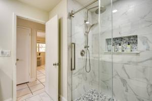 a bathroom with a shower with a glass door at Coconut Cove Mid-long term stays available Walk to Downtown Trolly to BEACHES in Sarasota +33 photos