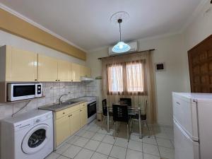 Kuchyň nebo kuchyňský kout v ubytování AURA Apartment