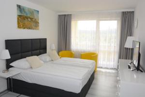 Postel nebo postele na pokoji v ubytování Apartmány - Frymburk My Family