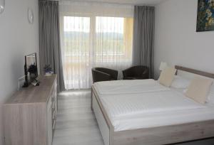 Postel nebo postele na pokoji v ubytování Apartmány - Frymburk My Family