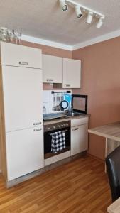 Kuchyň nebo kuchyňský kout v ubytování Zweizimmerwohnung - Ferienwohnung im Sankt Englmar